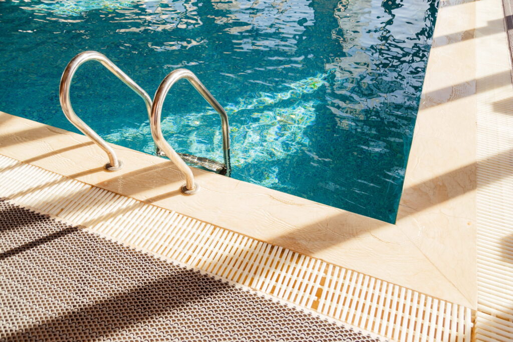 https://www.swimmingpoolrefurbishmentsessex.co.uk/wp-content/uploads/2026/08/grab-bars-ladder-in-the-blue-swimming-pool-2025-02-12-05-31-57-utc-1-1024x683-1.jpg